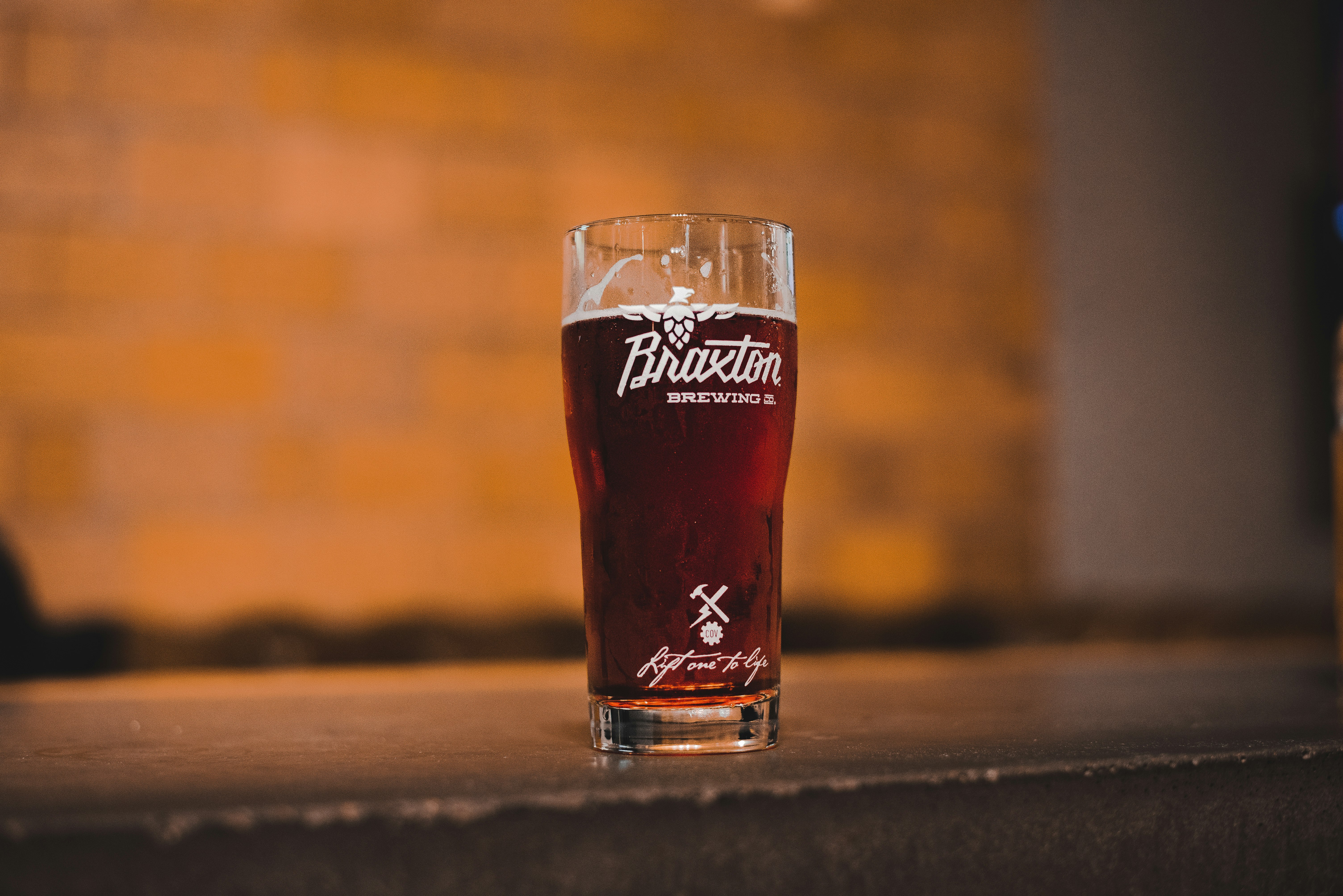 filled beer glass cup on table